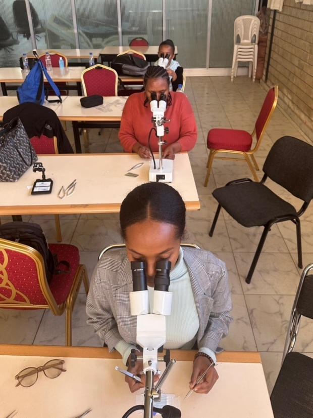 Students use desk microscopes
