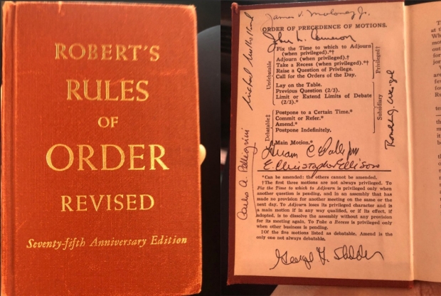 Dr. Hawn was presented with an heirloom copy of 'Robert's Rules of Order.'