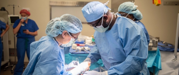 Dr. Wilson Alobuia assists Dr. Brooke Gurland in the main Stanford OR.