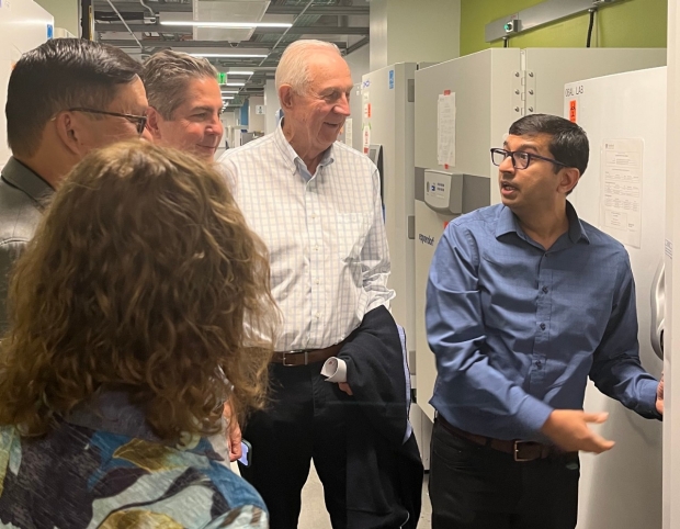 Members of the Baszucki Family tour the Biobank with Dr. Nazish Sayed.