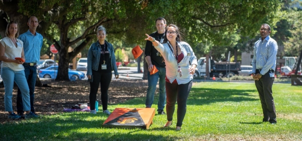 Surgery staffers compete in a game of corn hole during the 2019 Get Fit Challenge.